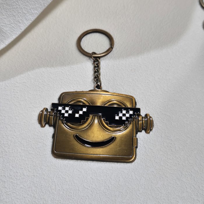 Factory sample of an antique-bronze metal robot keychain